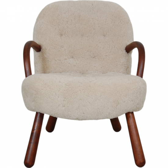 Clam chair reupholstered in sheepskin