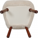 Clam chair reupholstered in sheepskin