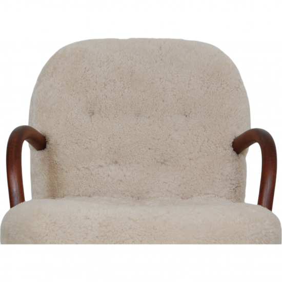 Clam chair reupholstered in sheepskin