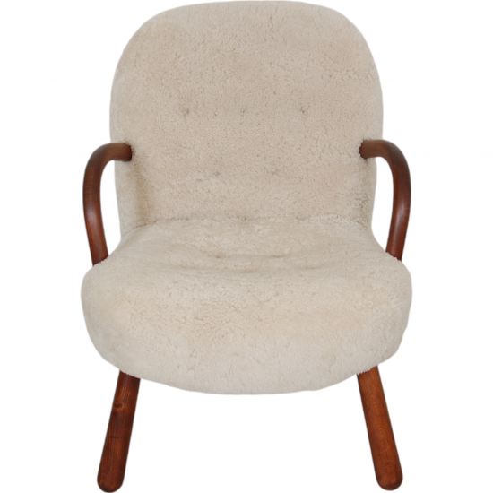 Clam chair reupholstered in sheepskin