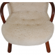 Clam chair reupholstered in sheepskin