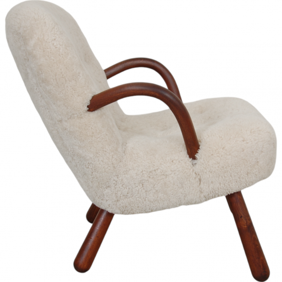 Clam chair reupholstered in sheepskin