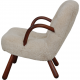 Clam chair reupholstered in sheepskin