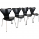 Set of four Arne Jacobsen Seven chairs in black Essential leather