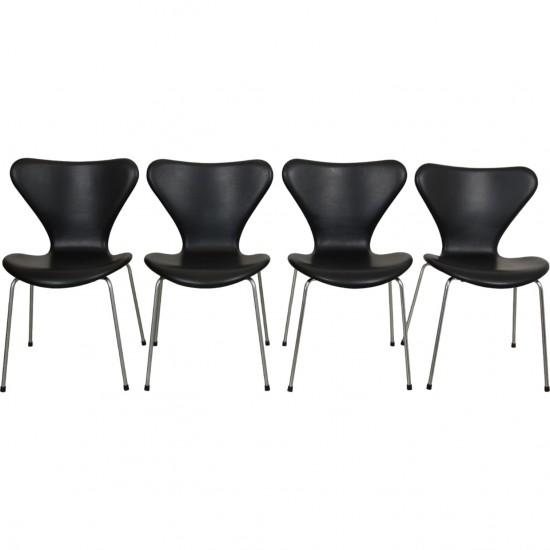 Set of four Arne Jacobsen Seven chairs in black leather 