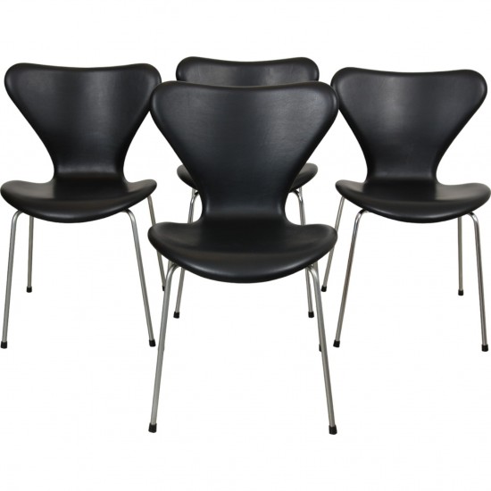 Set of four Arne Jacobsen Seven chairs in black leather 