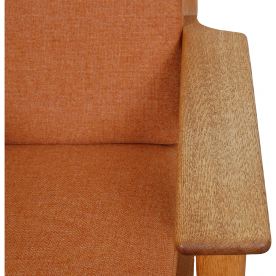 Hans Wegner GE-290a lounge chair in orange fabric